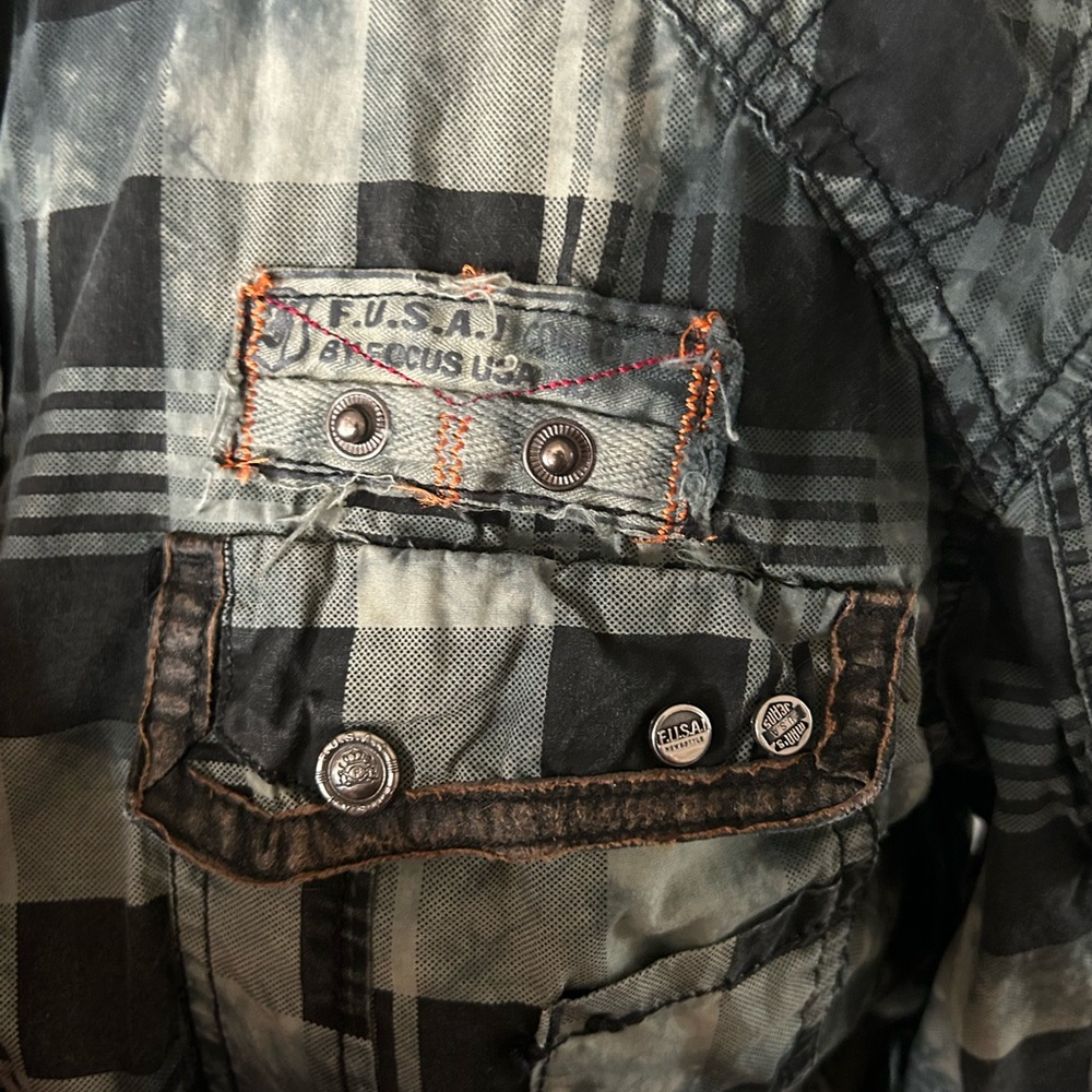 Large men’s shirt made by Focus USA INC
